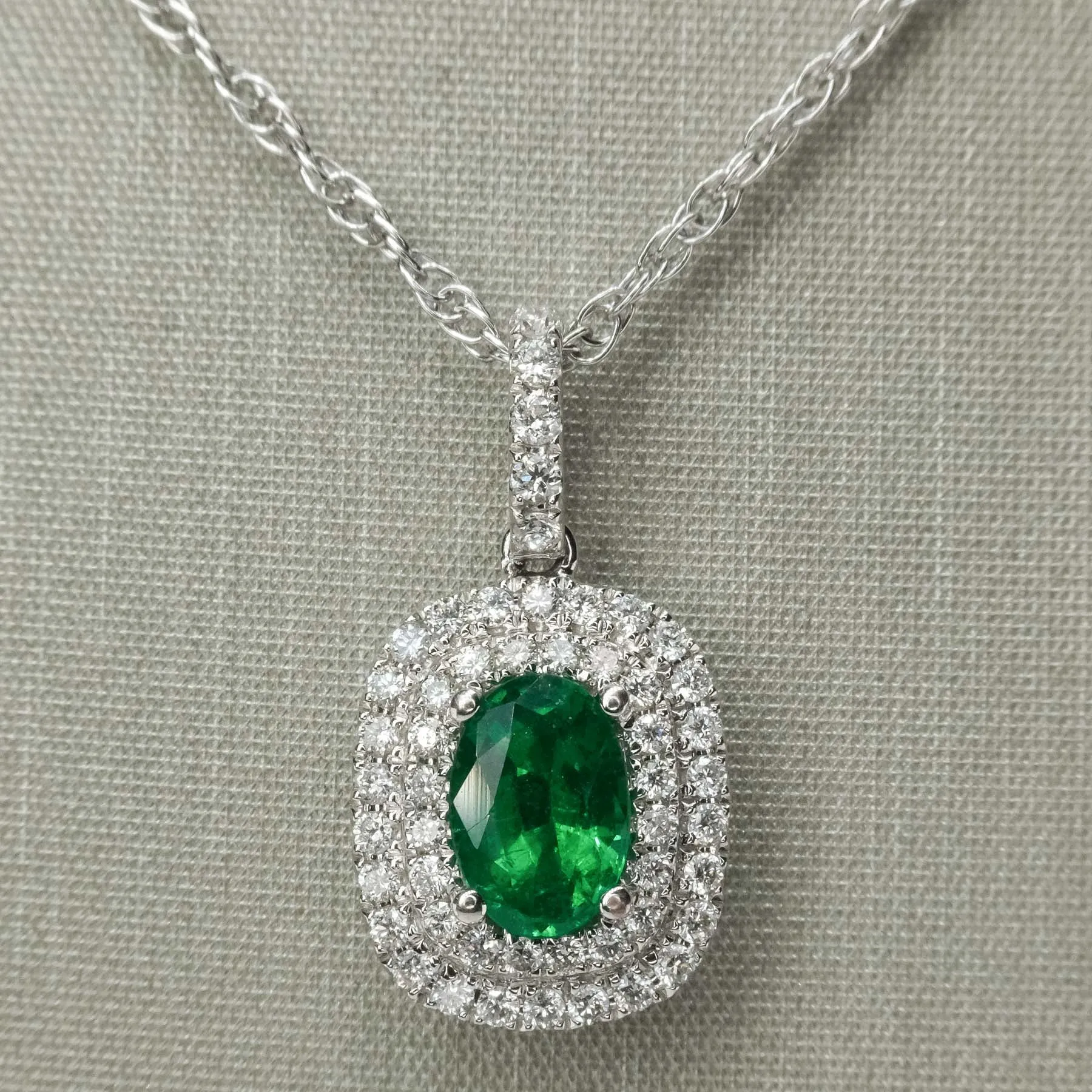 0.76ct Emerald & Diamond Accents Halo Pendant on 18" Chain in 14K/18K White Gold