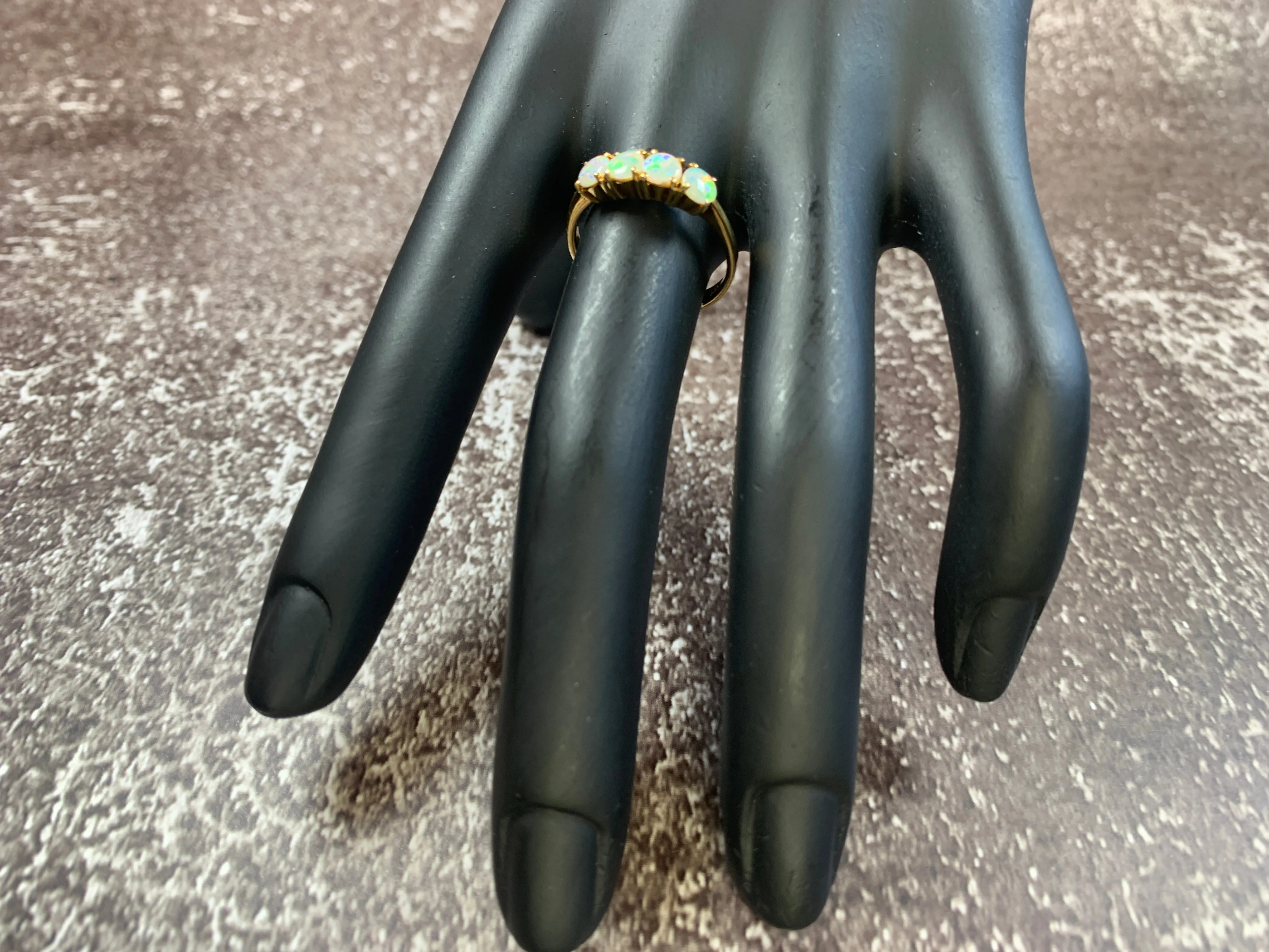 18kt Yellow Gold eternity ring with 5 Crystal Opals